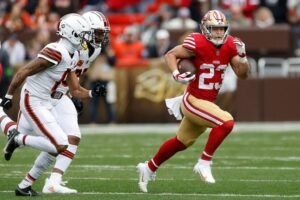 Christian McCaffrey running with the football for the San Francisco 49ers